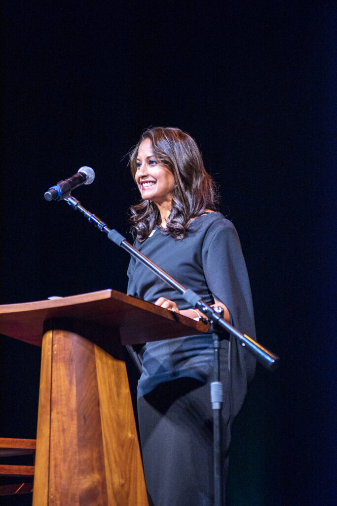 Tanuja Dehne at a podium